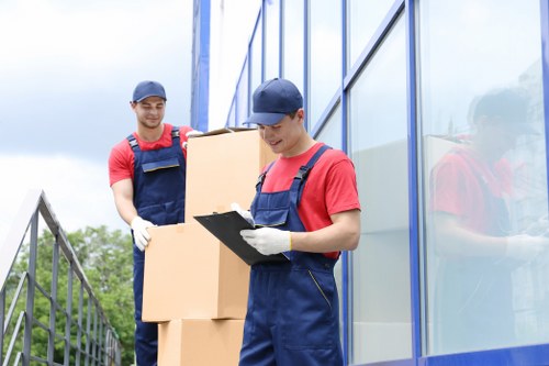 Mover carrying household items during a local removal service in Uxbridge