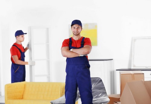 Staff using PPE while handling boxes and equipment