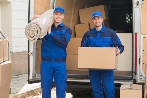 Removal van and packed boxes outside a typical Uxbridge home