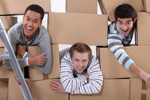 Boxes and furniture arranged inside a new home after moving