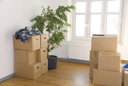 Professional movers loading household items for transport