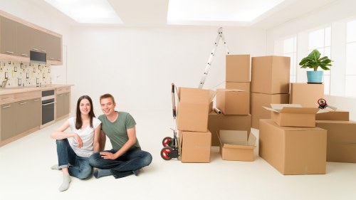 Professional movers unloading furniture at a new home in Uxbridge