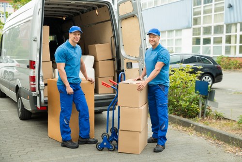 Loading furniture into a local moving van