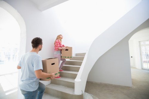Furniture and boxes being loaded into a removal van