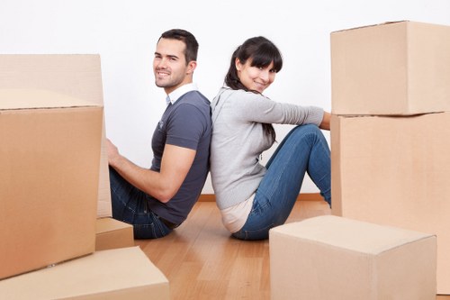 Preparing for removal truck hire with packed boxes and moving items