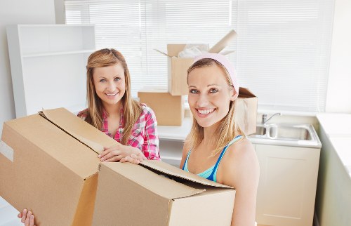 Local moving team handling boxes and furniture in Uxbridge