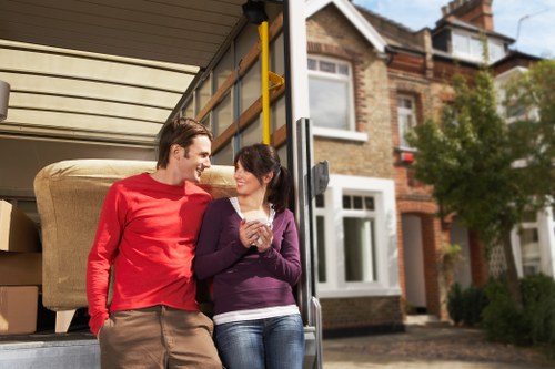 Loading furniture into a removal van during a house move